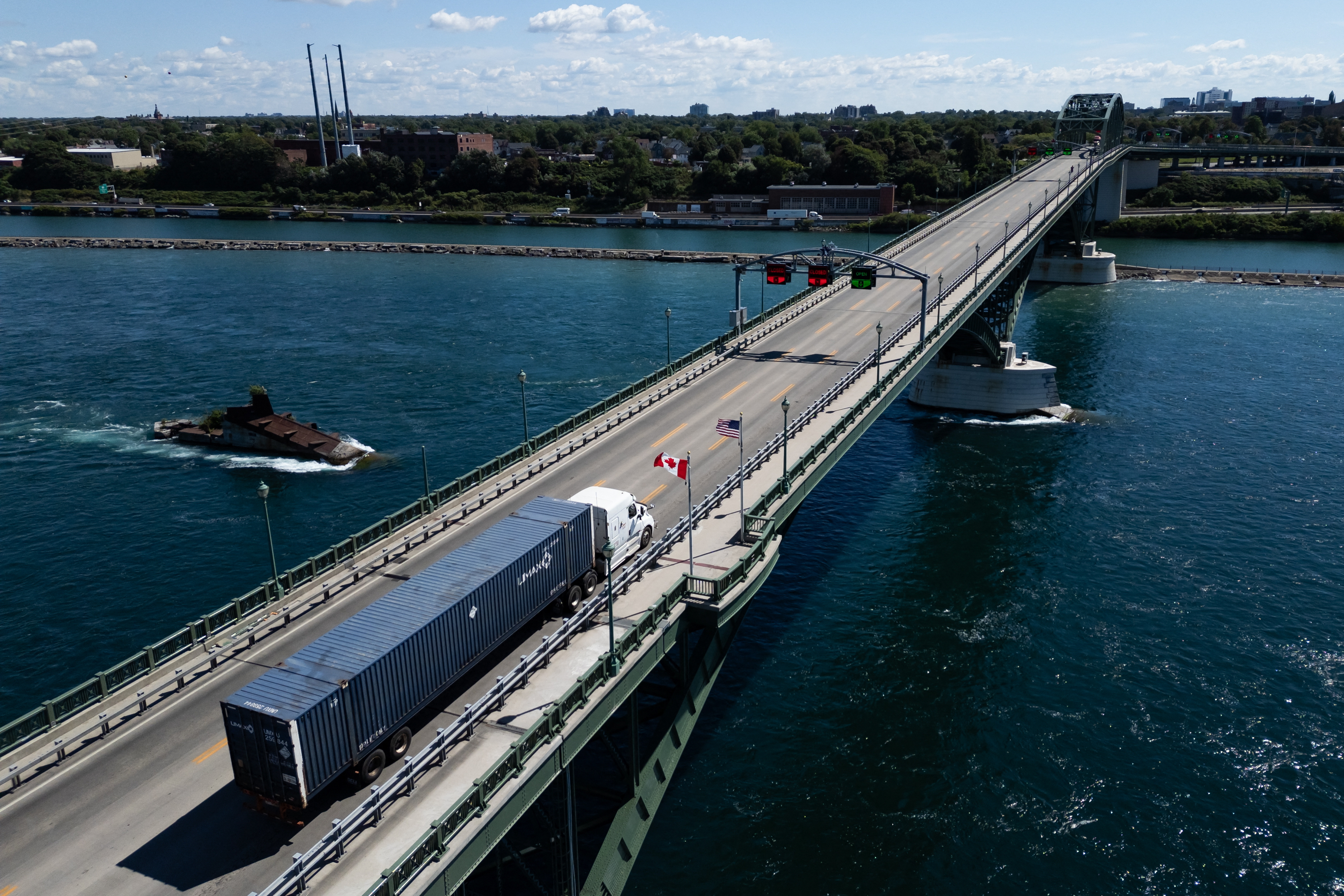 A truck passes over the Peace Bridge between Canada and the United States, in Fort Erie, Ontario, on August 18, 2026.